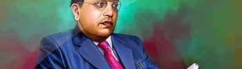 Image of Dr. B. R. Ambedkar in blue suit having a book in his hands